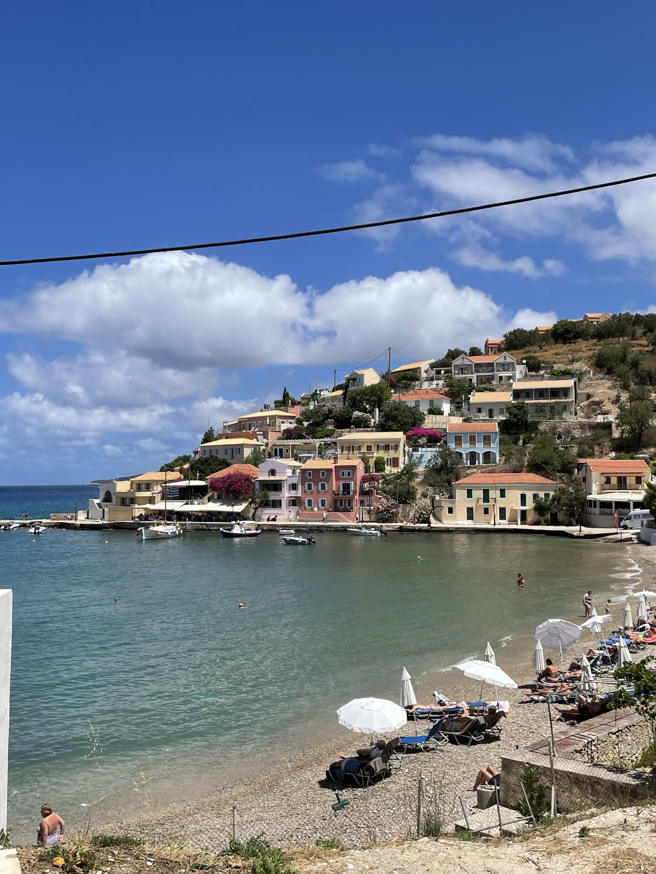 beach with coastal houses in greece