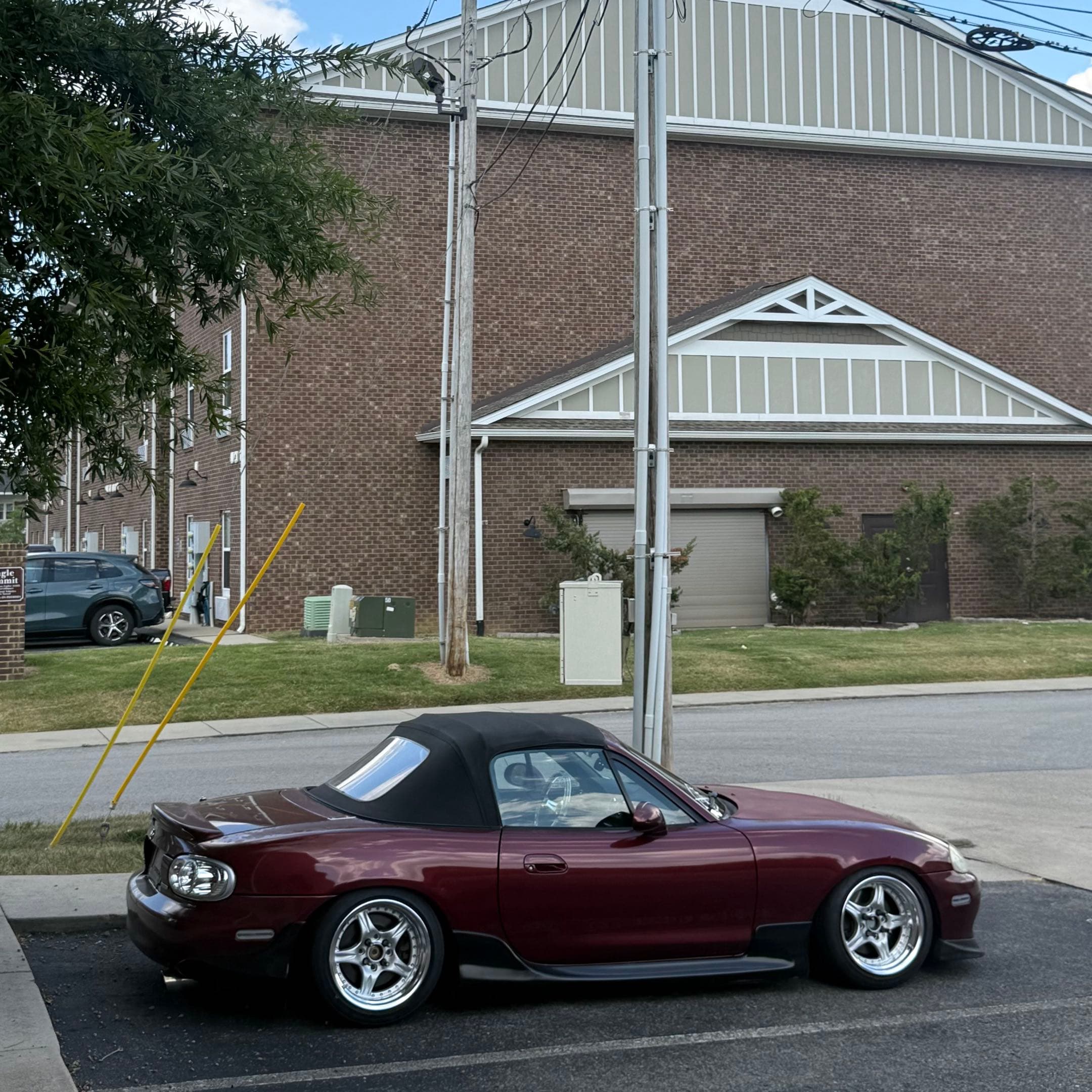 current iteration of the miata. on cst precedeo demon cambers, in a parking spot.